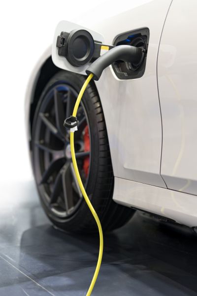 Image of a white electric vehicle charging